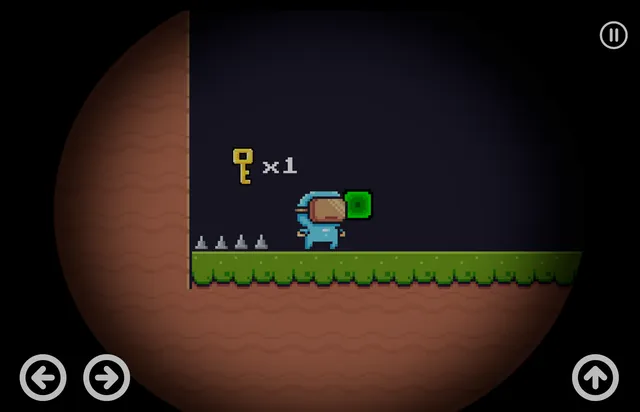 A dark underground level where the player stands next to a green switch block near a row of spikes, with a collected-keys counter reading "x1".